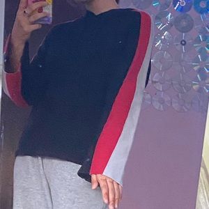 inc top with red and white sleeves